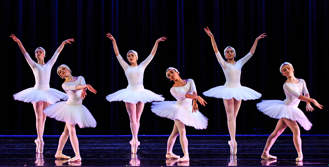 How to Learn to Appreciate Ballet represented by utah ballet dancers on stage in various positions