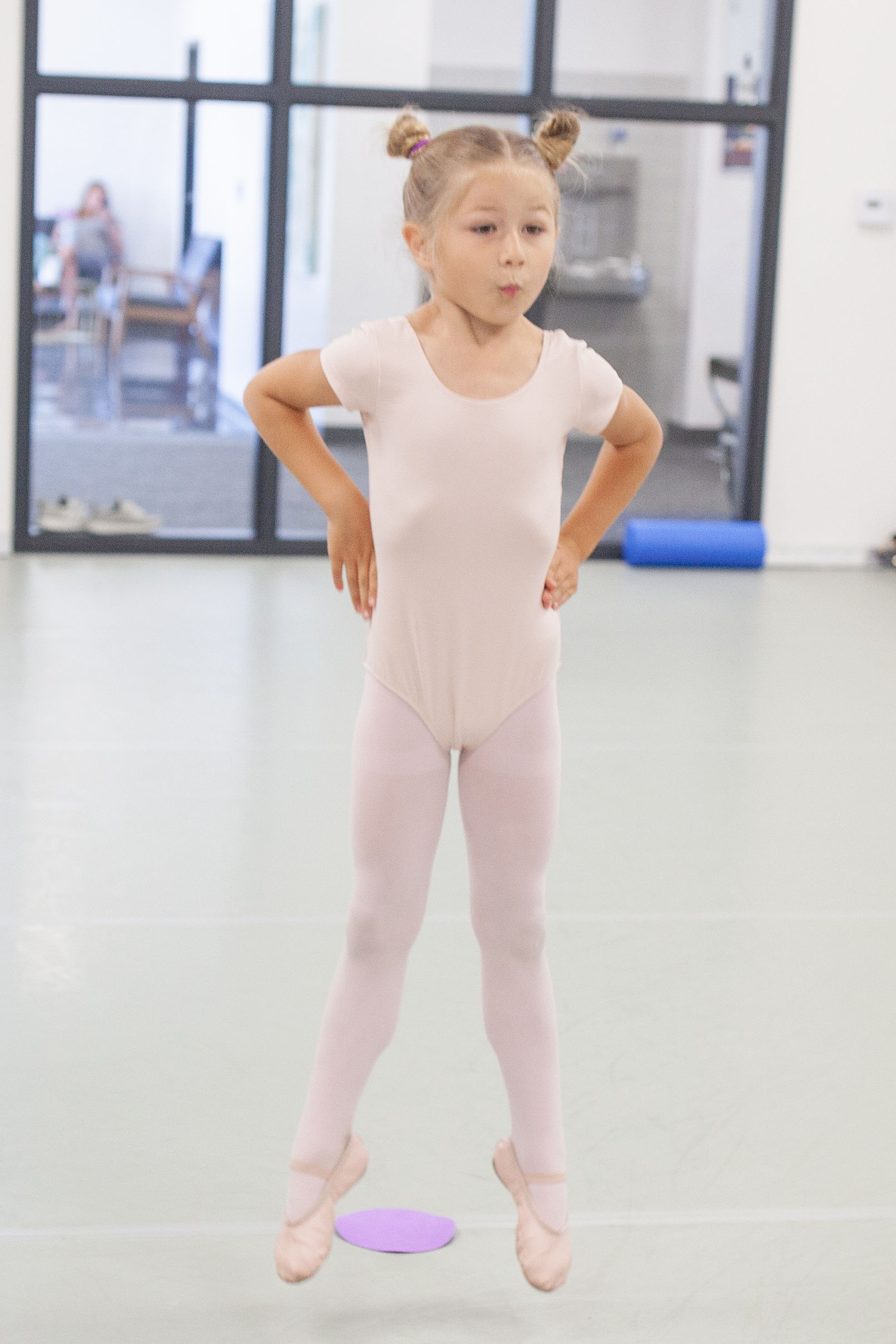 Preschool young child in ballet class in Utah jumping in front of dot