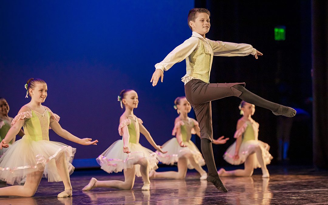 Young children in ballet class on stage performing Nutcracker