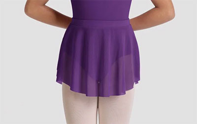 Ballet dancer wearing an aubergine skirt